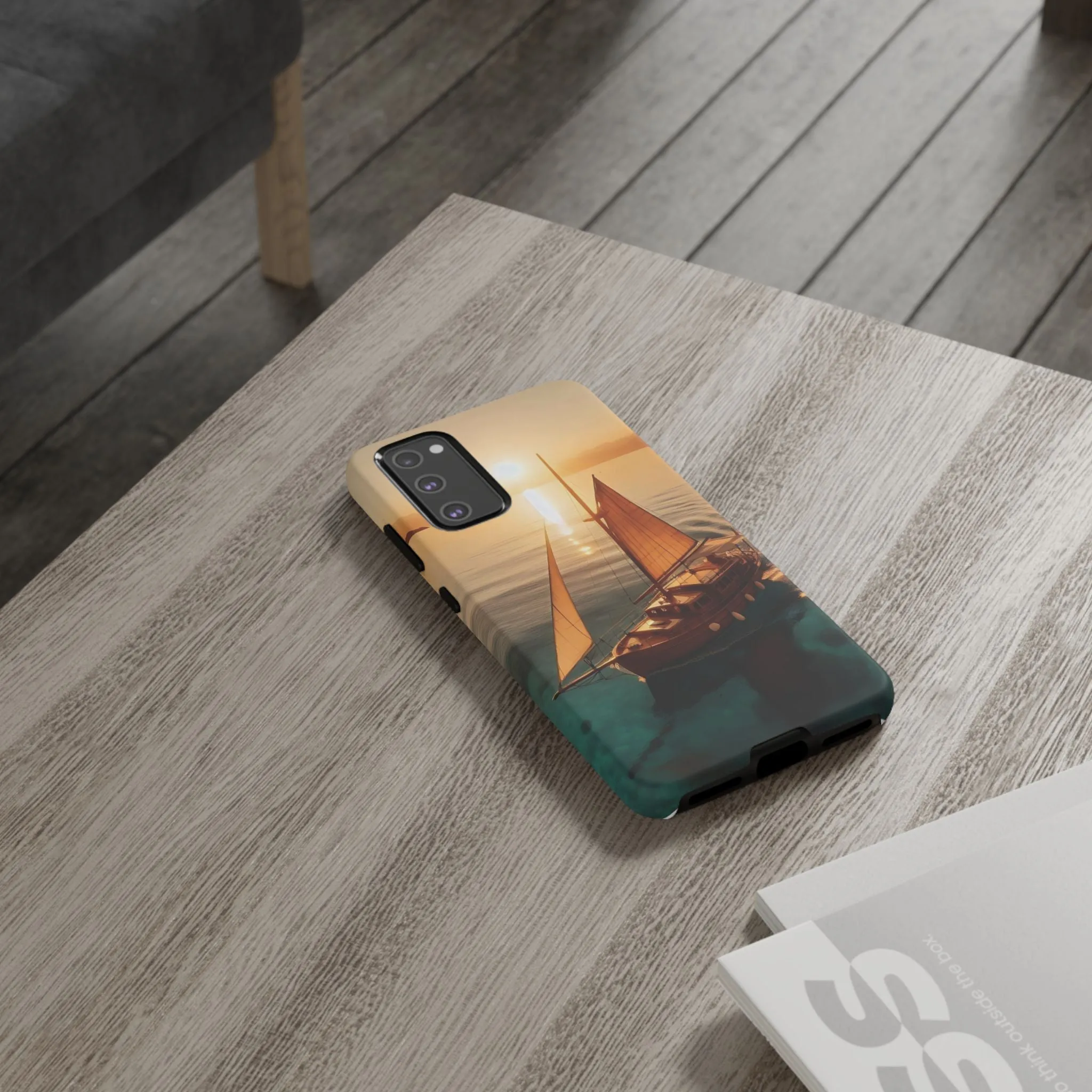 Sailing boat and sunset on a clear seaTough Cases